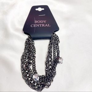 NEW multi chain bracelet with sparkly charms black metal chain size adjustment.